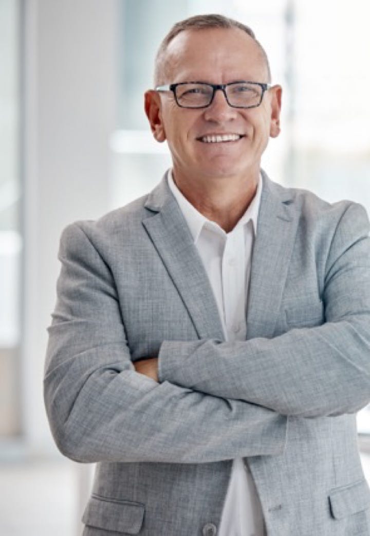 Man dressed casual smart smiling with arms folded